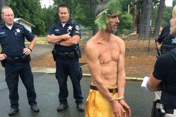 Murder suspect arrested wearing bright yellow loincloth and a branch on his head